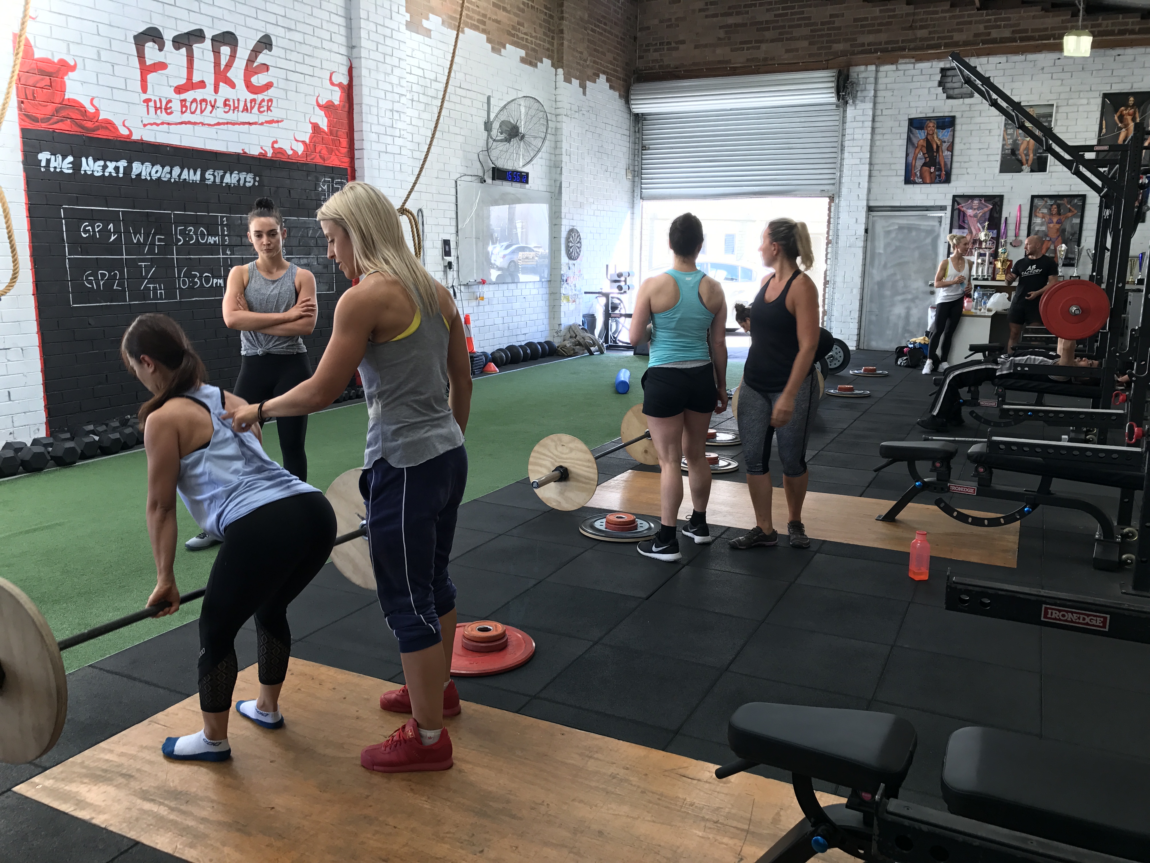 Trish coaching clients in the gym
